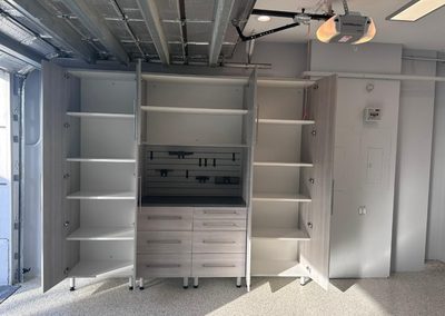 Krasik – Polyaspartic Floor, Cabinets, Monkey Bar Shelving, Slat Wall (Delray Beach, Florida)
