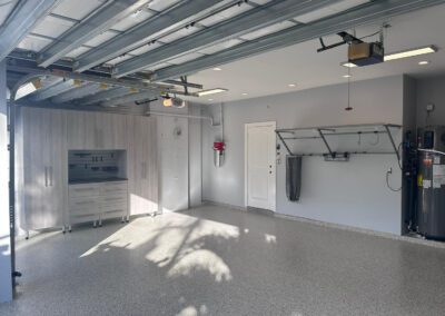 Krasik – Polyaspartic Flooring, Cabinets, Monkey Bar Shelving System, and Slat Wall (Delray Beach, Florida)